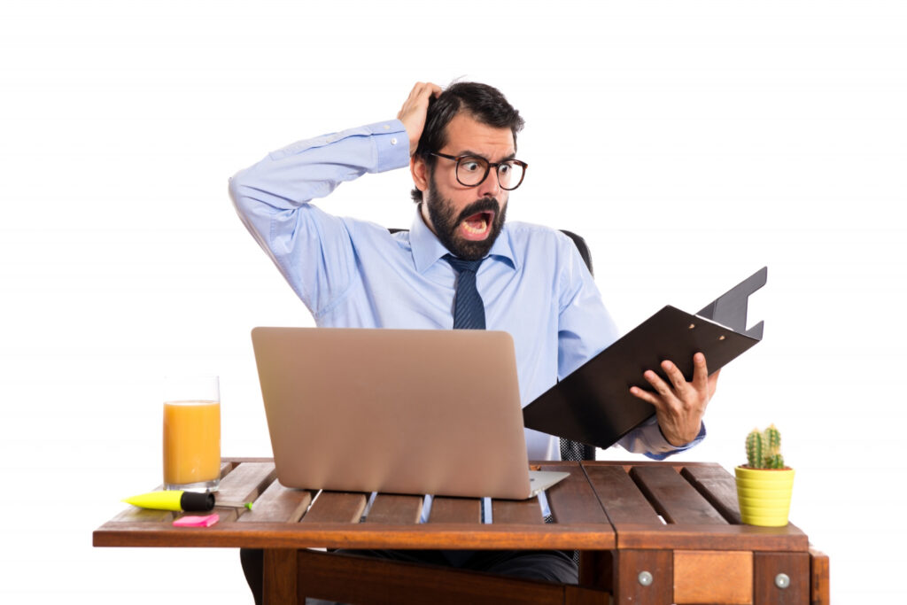 Confused businessman stressing over common AI implementation mistakes in business