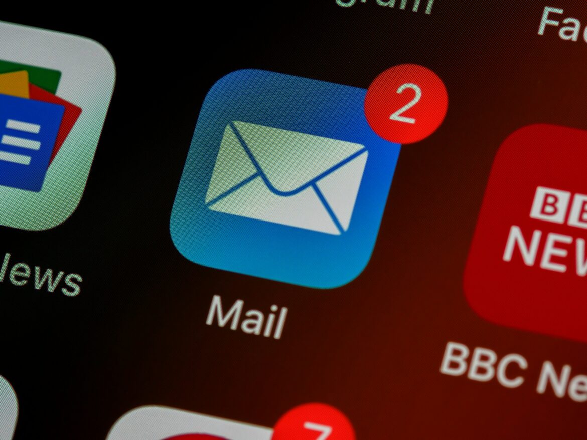 Smartphone screen displaying the email app icon with a red notification badge for unread messages